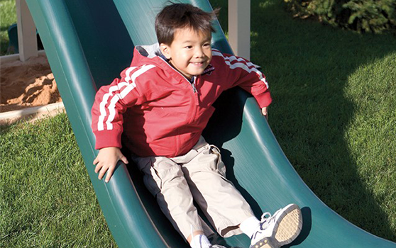 boy on playset during the winter