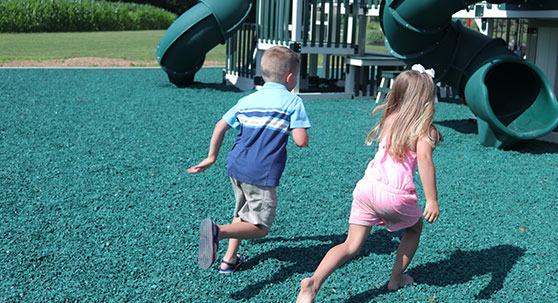 best material for playground surfaces